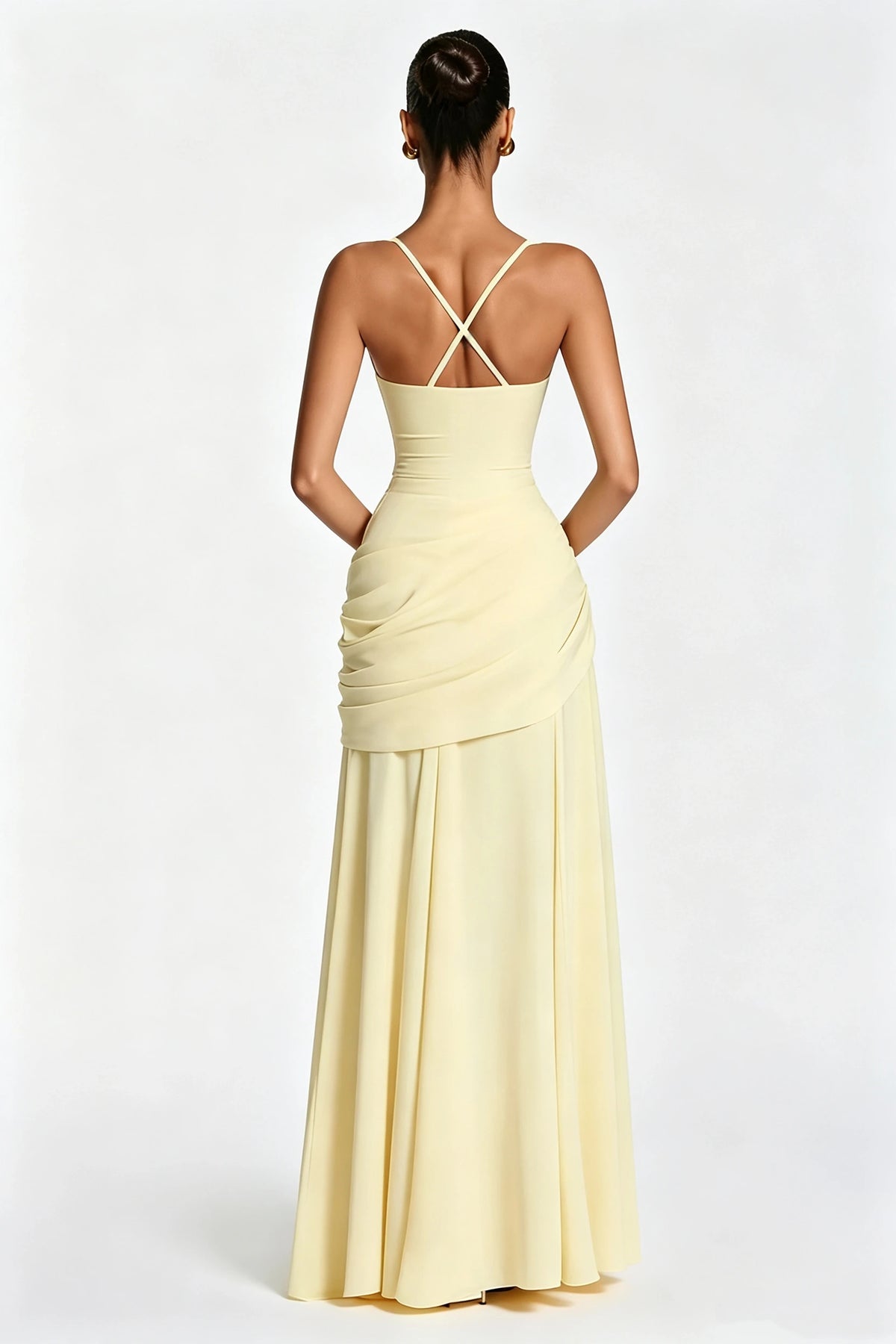 Sophisticated pale yellow square-neck maxi dress with ruching and a fitted waist.