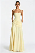 Sophisticated pale yellow square-neck maxi dress with ruching and a fitted waist.