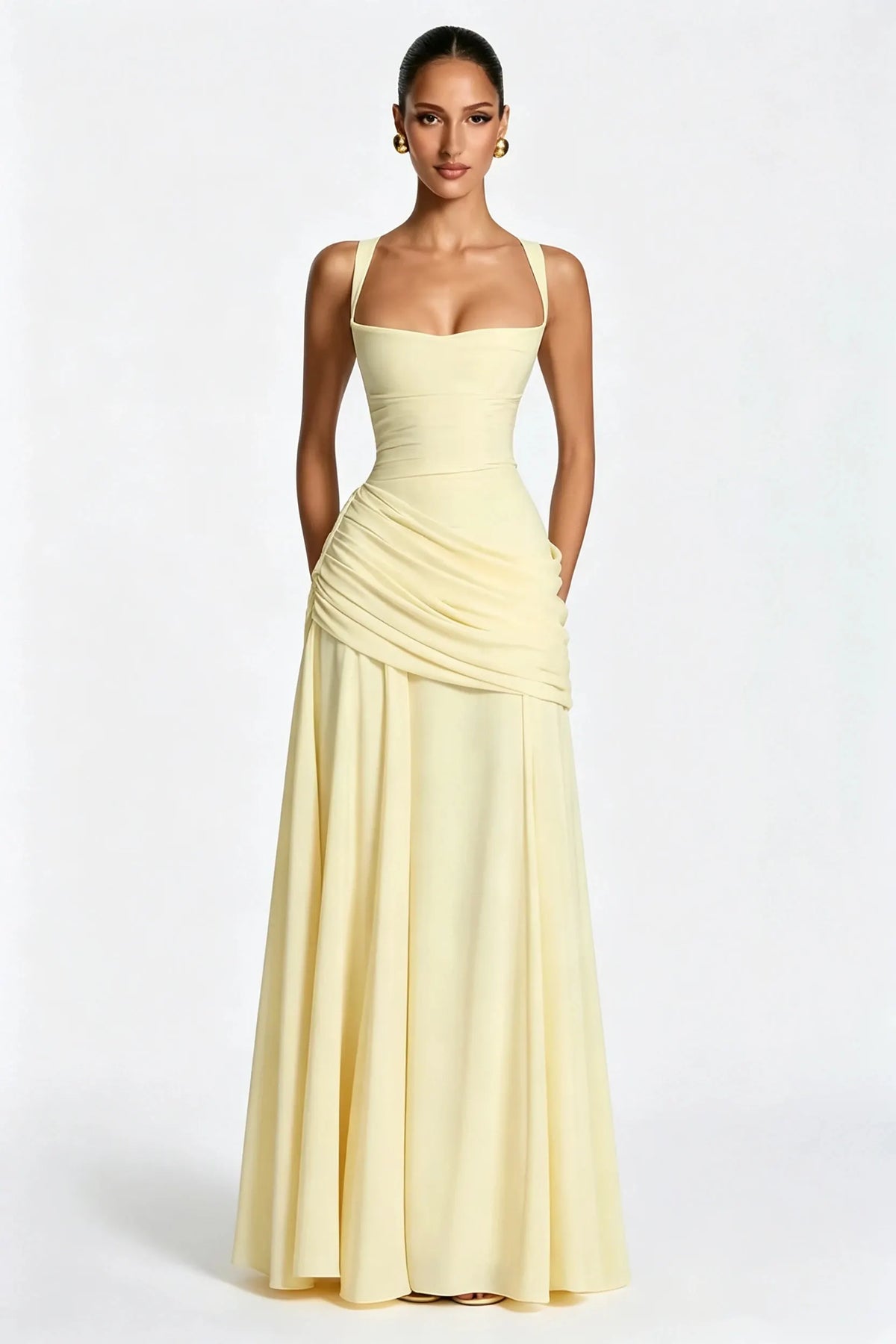 Sophisticated pale yellow square-neck maxi dress with ruching and a fitted waist.